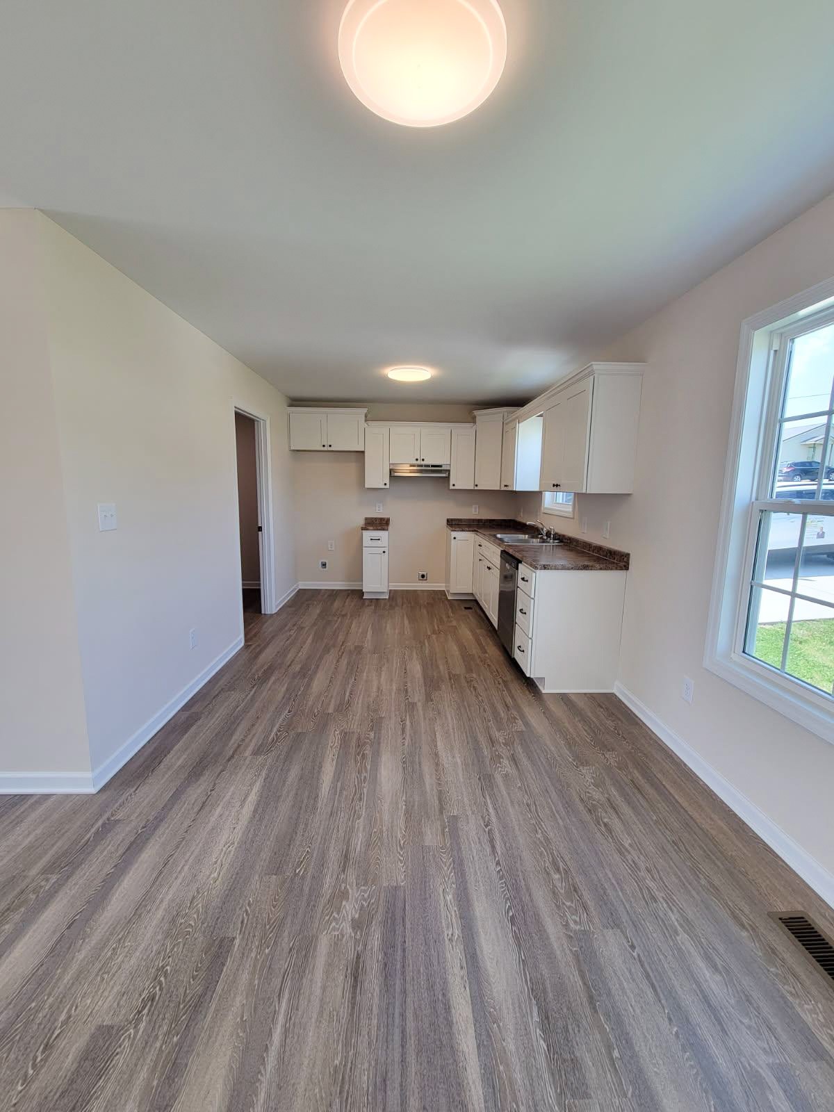 62 Modena Place Decherd, TN 37324 - Photo 7 of 31 a view of a kitchen with wooden floor and a sink