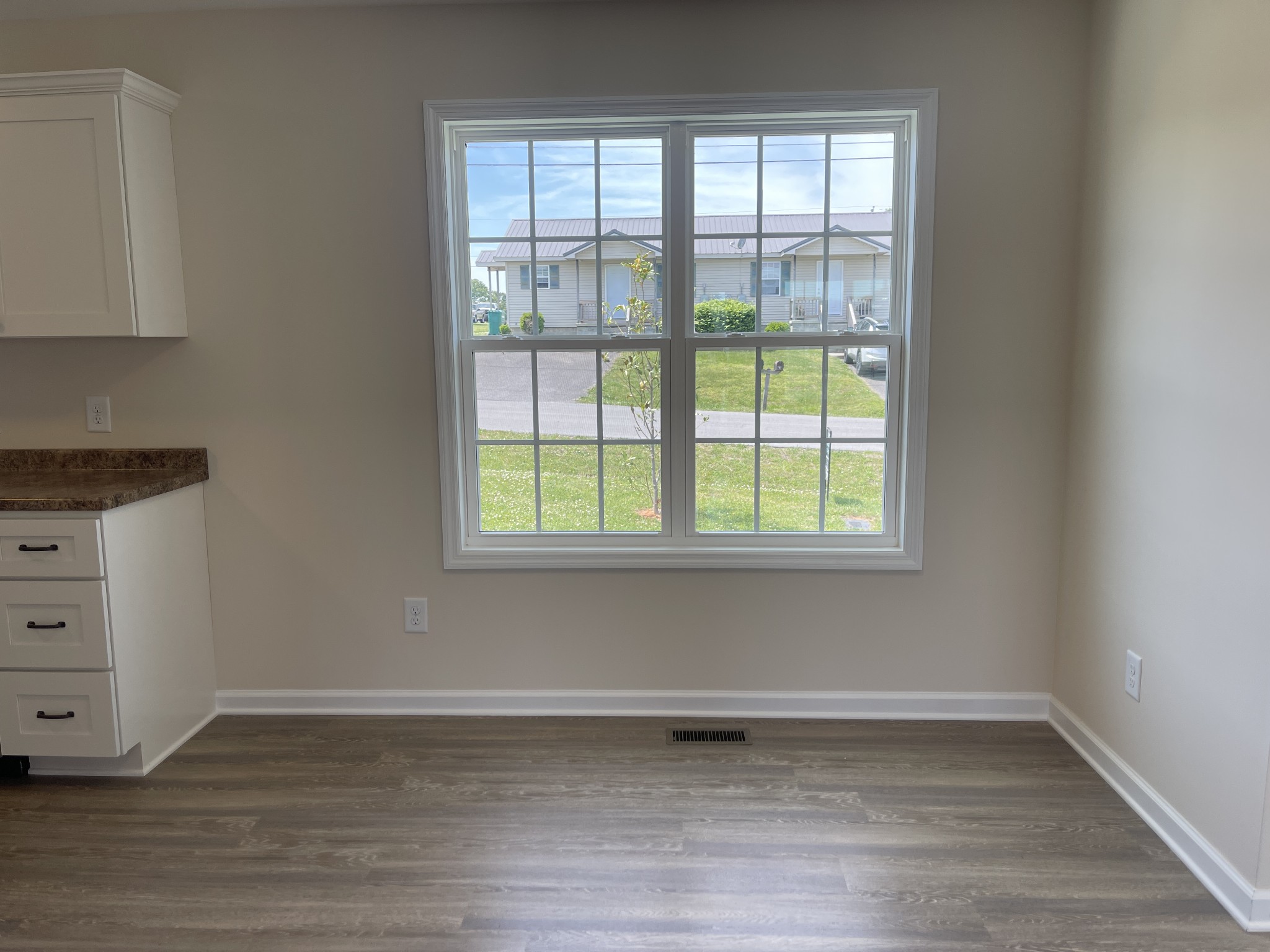 62 Modena Place Decherd, TN 37324 - Photo 10 of 31 a view of a room with wooden floor and cabinets
