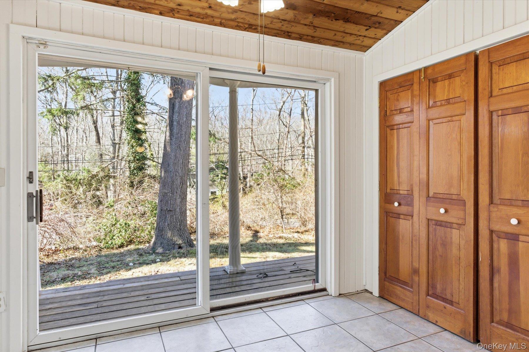 45 Eastwood Road Miller Place, NY 11764 - Photo 20 of 45 a view of a room that has a large window and front door