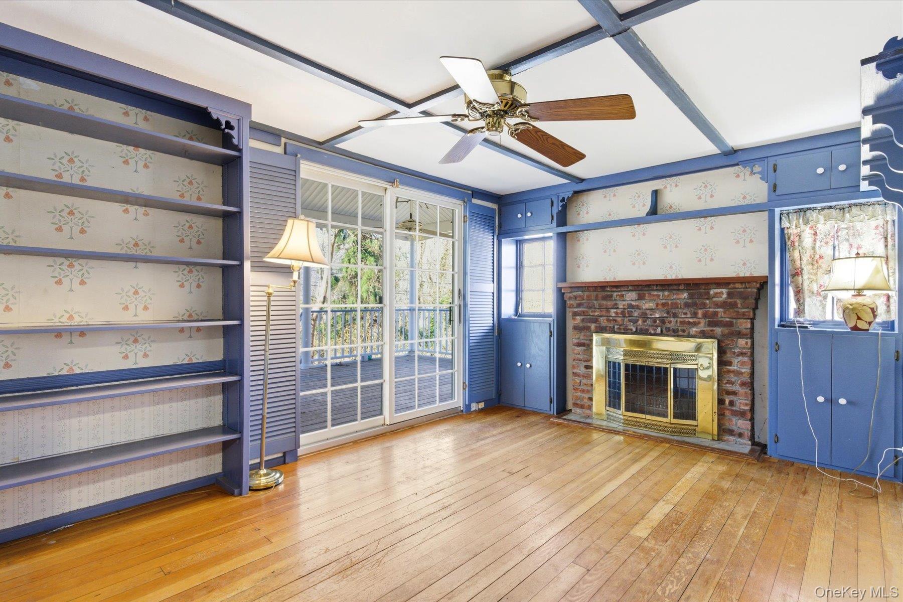 45 Eastwood Road Miller Place, NY 11764 - Photo 22 of 45 a view of an empty room with a fireplace and a window