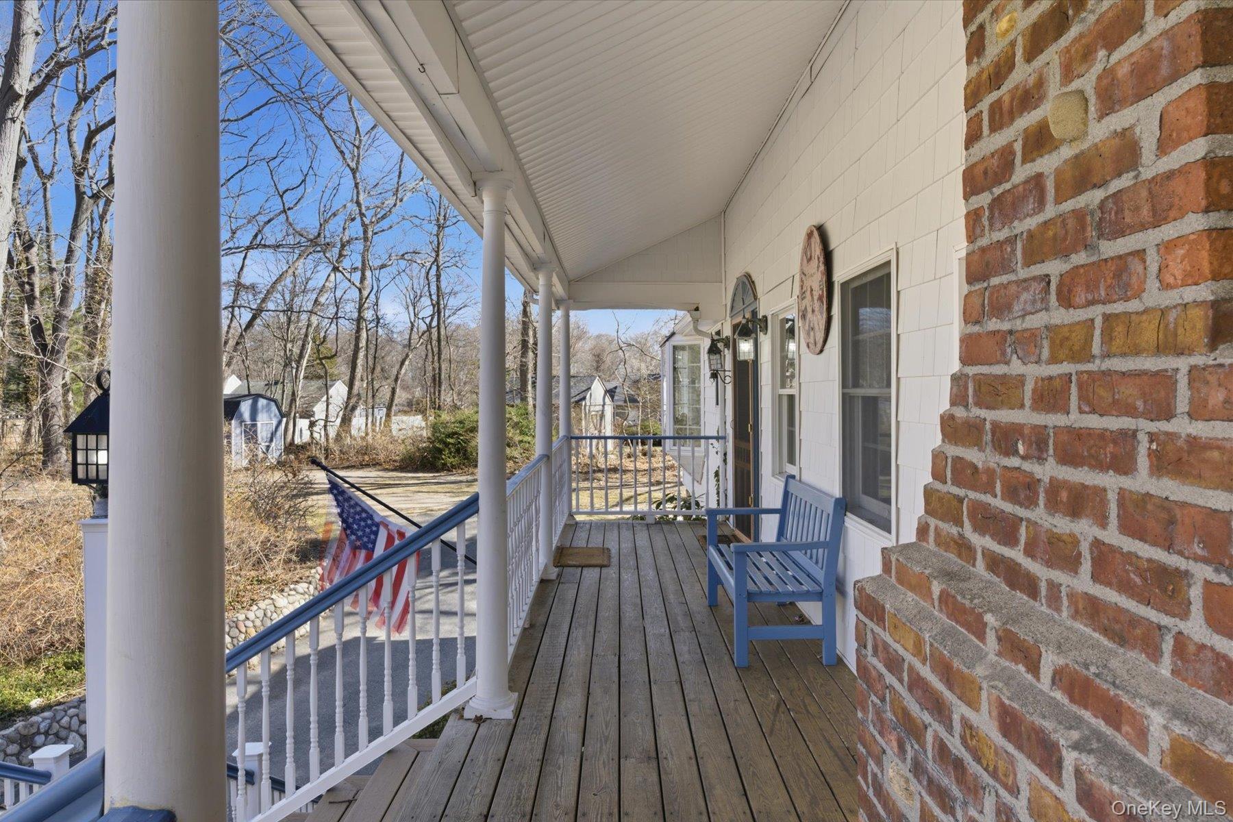 45 Eastwood Road Miller Place, NY 11764 - Photo 28 of 45 a view of balcony with wooden floor and outdoor seating