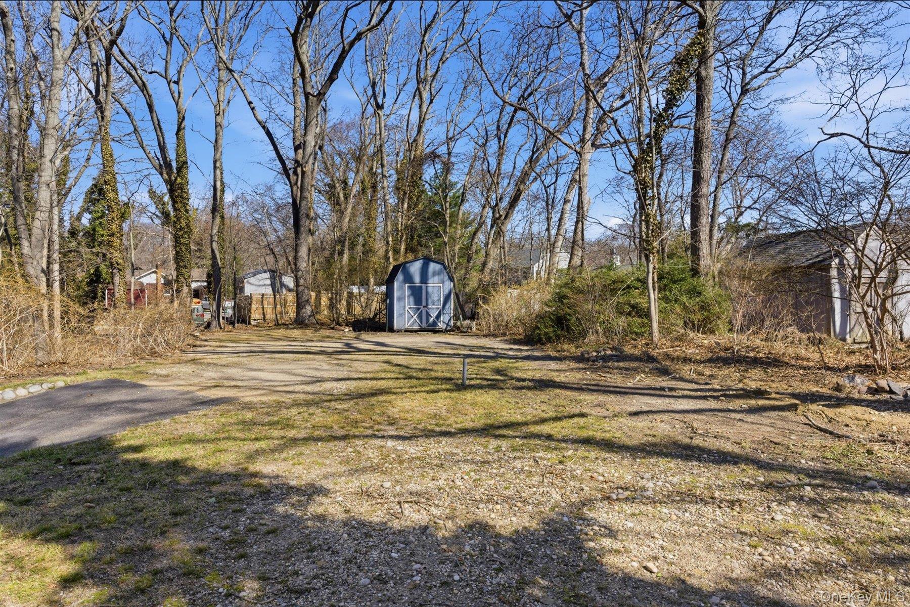 45 Eastwood Road Miller Place, NY 11764 - Photo 33 of 45 a view of road with large trees