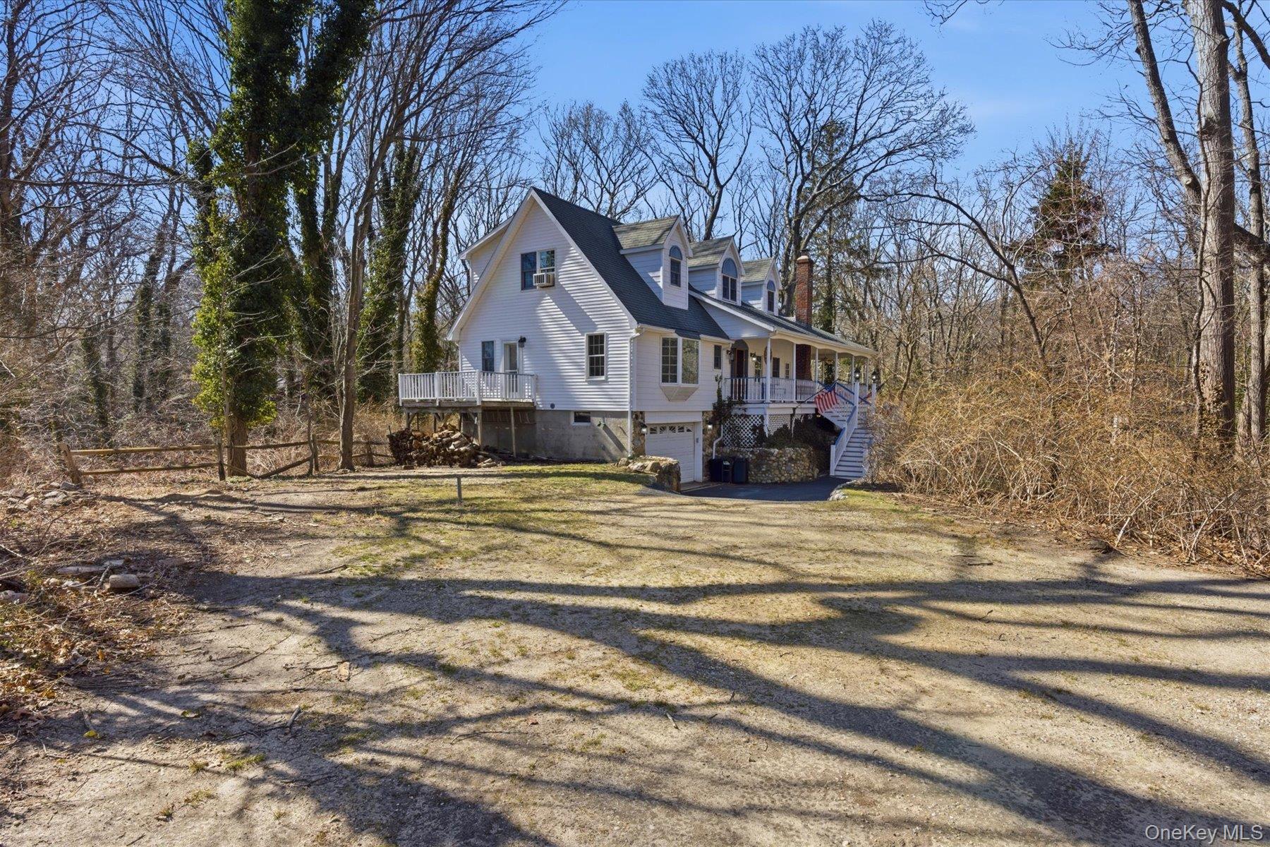 45 Eastwood Road Miller Place, NY 11764 - Photo 35 of 45 a front view of a house with a yard