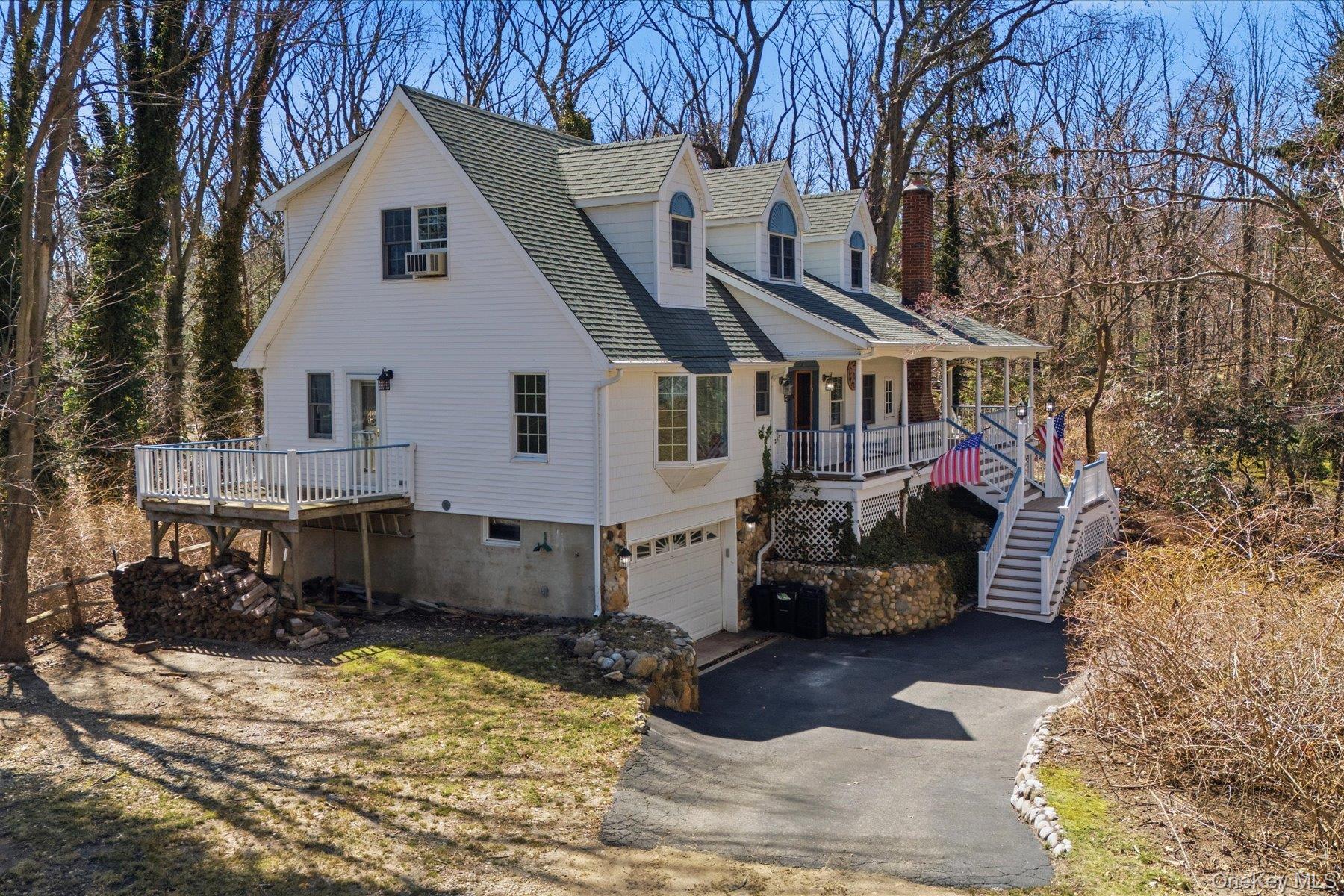 45 Eastwood Road Miller Place, NY 11764 - Photo 36 of 45 a front view of a house with a yard