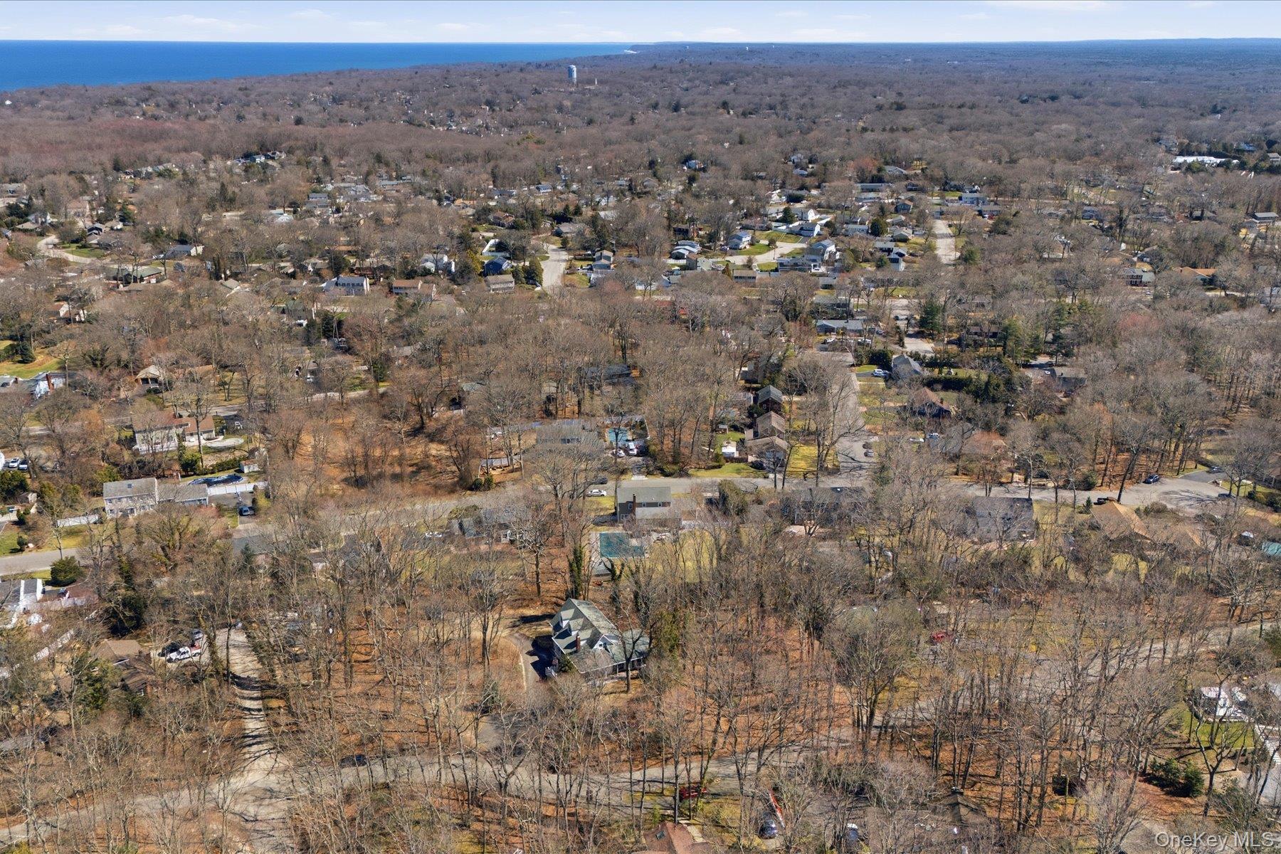 45 Eastwood Road Miller Place, NY 11764 - Photo 5 of 45 an aerial view of house with yard and mountain view