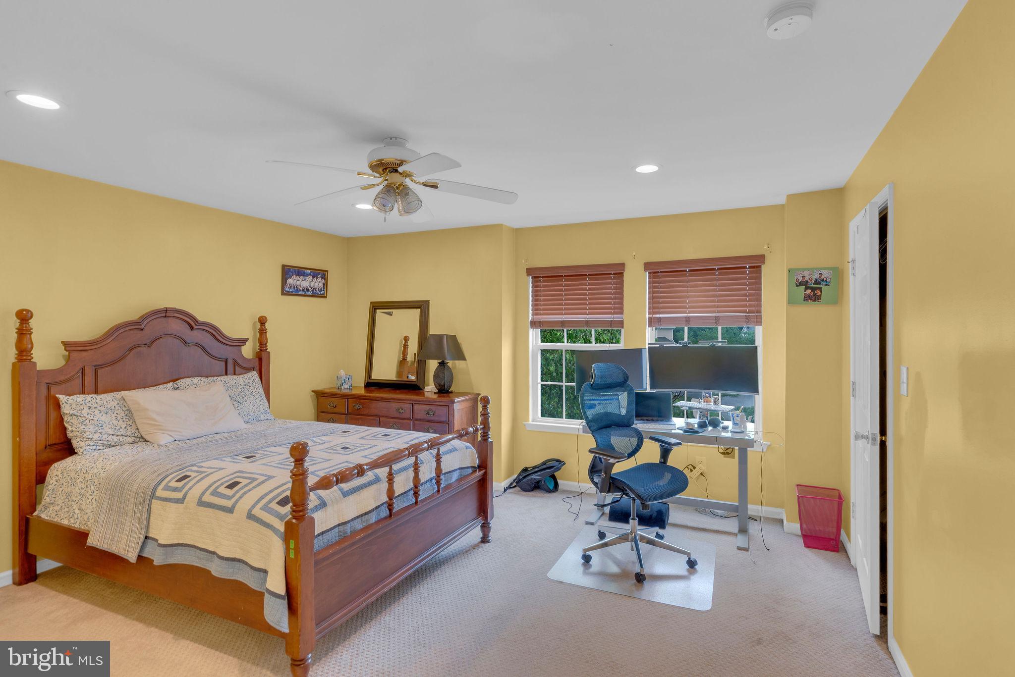 16 Cardiff Court Princeton Junction, NJ 08550 - Photo 29 of 60 a bedroom with a bed and large windows