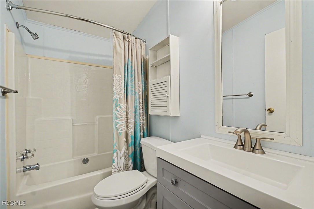 5228 Stringfellow Road St. James City, FL 33956 - Photo 12 of 35 a bathroom with a sink a toilet and shower