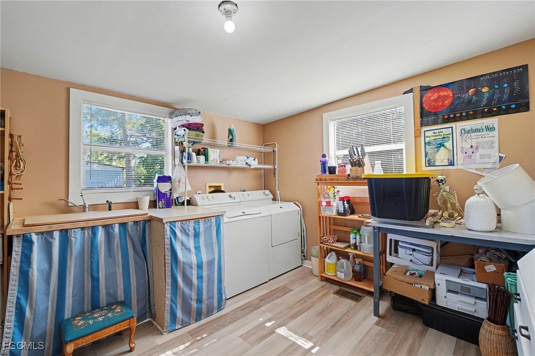 5228 Stringfellow Road St. James City, FL 33956 - Photo 17 of 35 a room with furniture a flat screen tv and a window