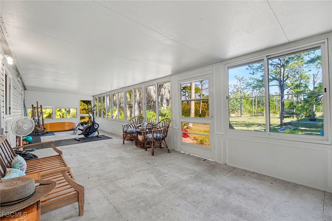 5228 Stringfellow Road St. James City, FL 33956 - Photo 18 of 35 a view of a room with furniture and a large window