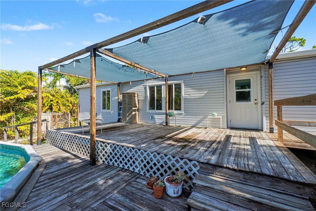5228 Stringfellow Road St. James City, FL 33956 - Photo 21 of 35 a view of outdoor space and deck