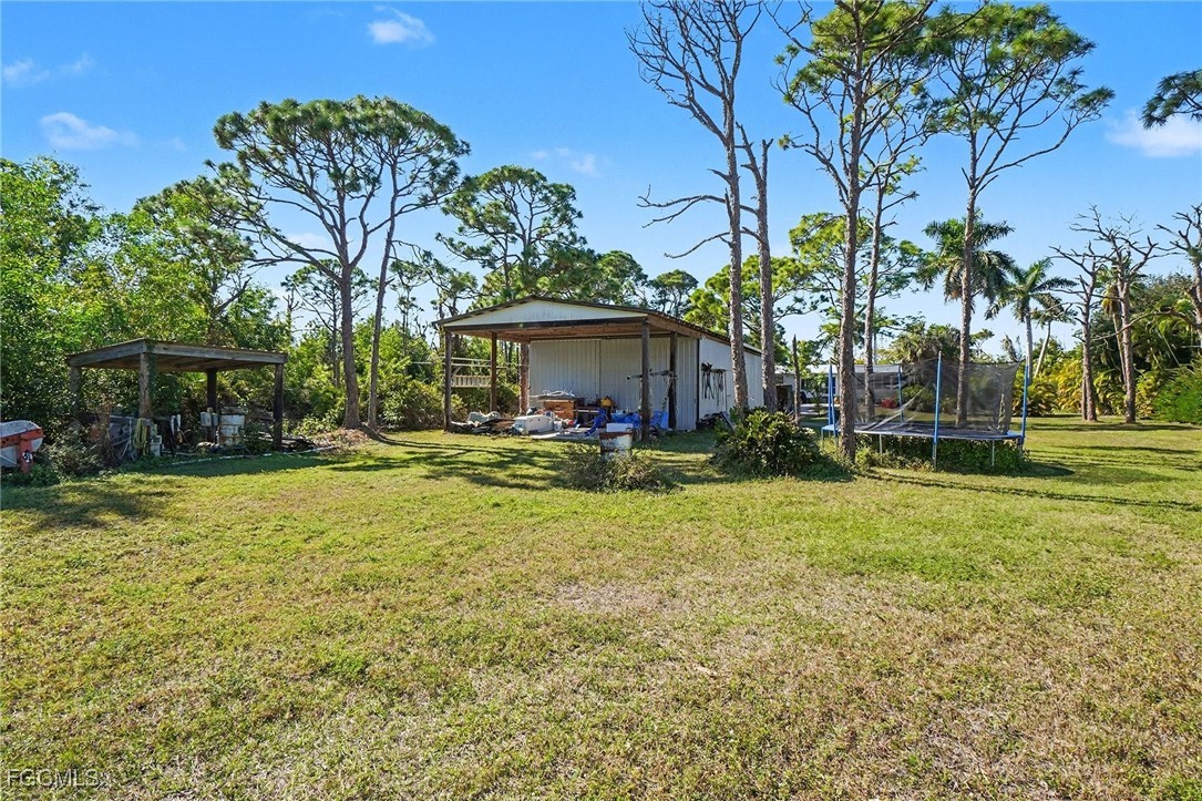 5228 Stringfellow Road St. James City, FL 33956 - Photo 28 of 35 a view of a house with swimming pool
