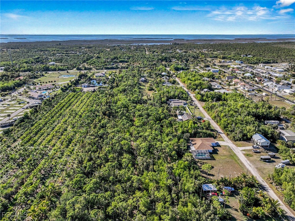 5228 Stringfellow Road St. James City, FL 33956 - Photo 32 of 35 an aerial view of residential houses with outdoor space and trees