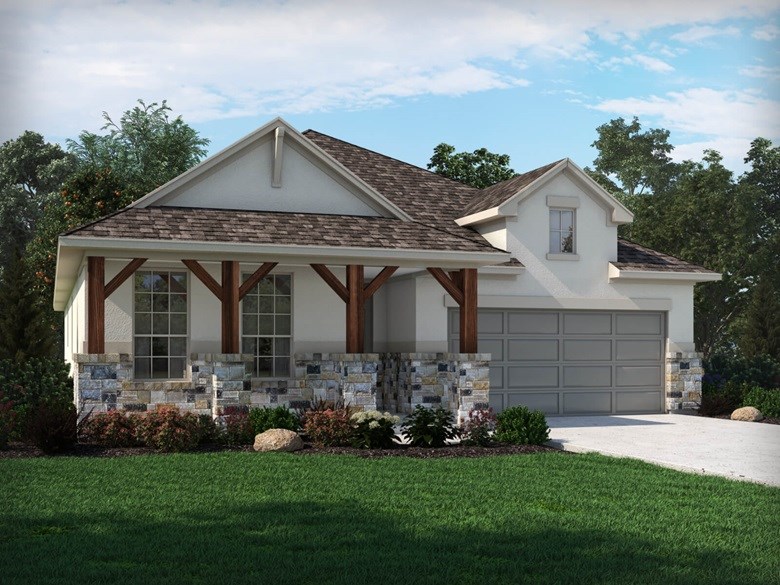 a front view of a house with a garden and plants
