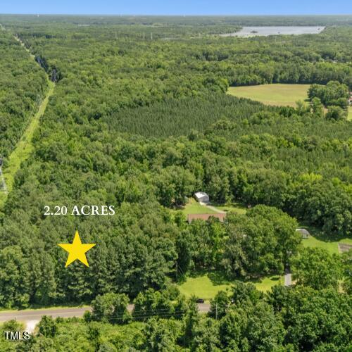 4300 Jeffries Road Durham, NC 27704 - Photo 3 of 4 a view of a lake with a yard