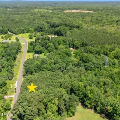 a view of a yard with an outdoor space