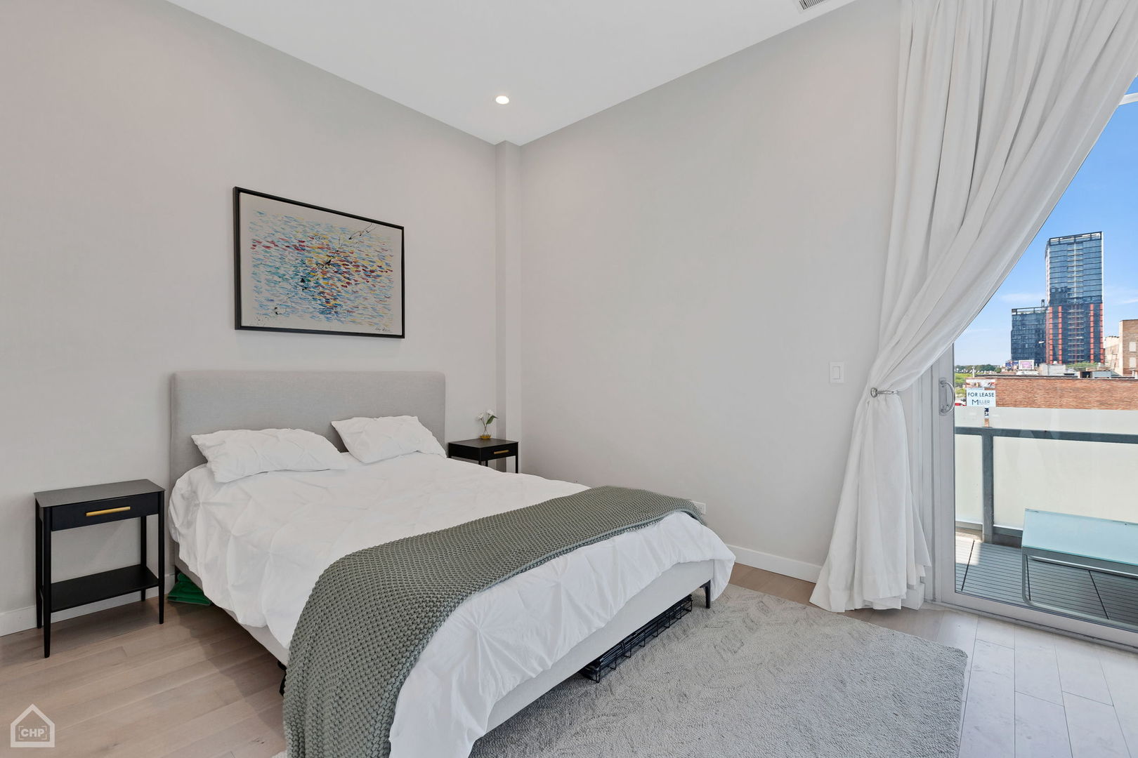 155 North Aberdeen Street, Unit 304 Chicago, IL 60607 - Photo 12 of 33 a bedroom with a bed and a night stand