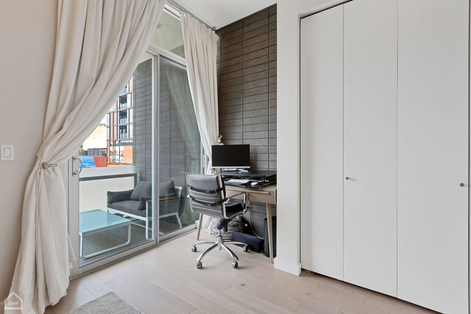 155 North Aberdeen Street, Unit 304 Chicago, IL 60607 - Photo 13 of 33 a view of a workspace with furniture and a window