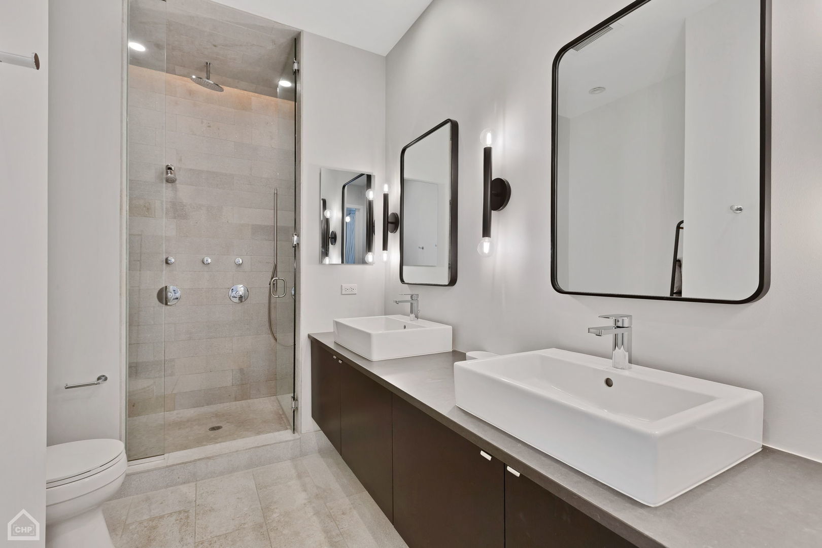 155 North Aberdeen Street, Unit 304 Chicago, IL 60607 - Photo 22 of 33 a bathroom with a double vanity sink mirror double and shower