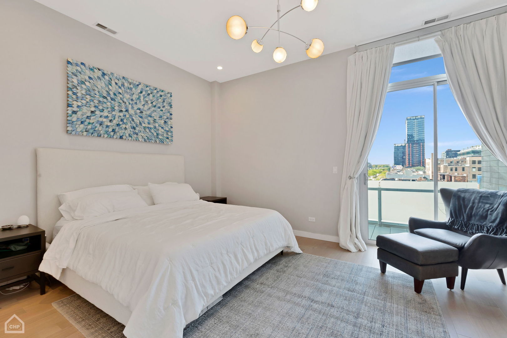 155 North Aberdeen Street, Unit 304 Chicago, IL 60607 - Photo 25 of 33 a bedroom with a bed window and a couch