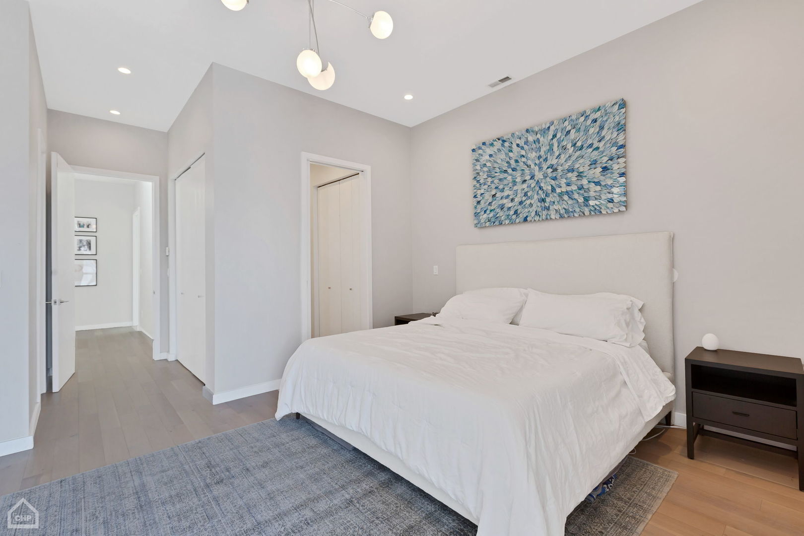 155 North Aberdeen Street, Unit 304 Chicago, IL 60607 - Photo 27 of 33 a bedroom with a bed and a painting on the wall