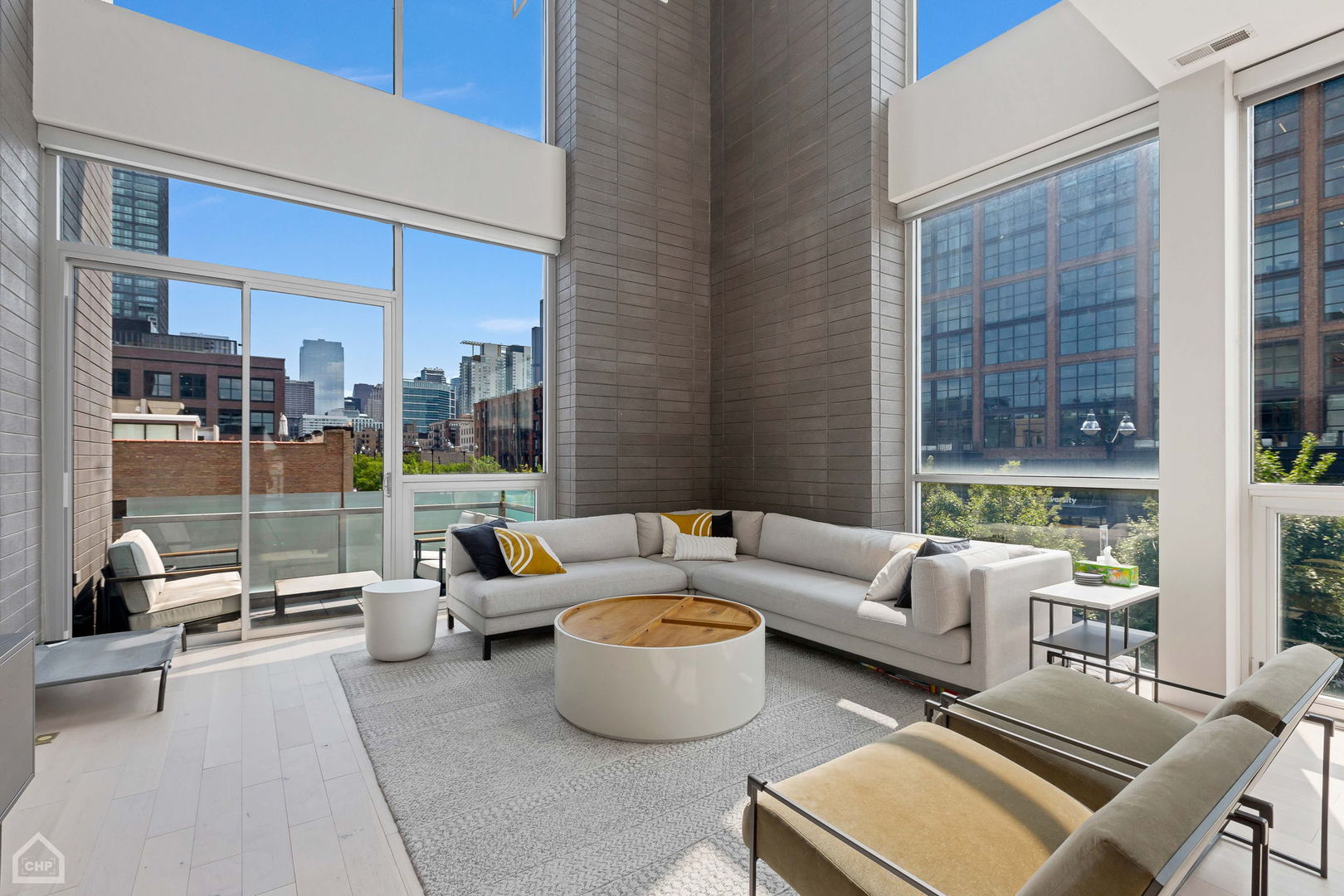 155 North Aberdeen Street, Unit 304 Chicago, IL 60607 - Photo 3 of 33 a living room with furniture and a floor to ceiling window