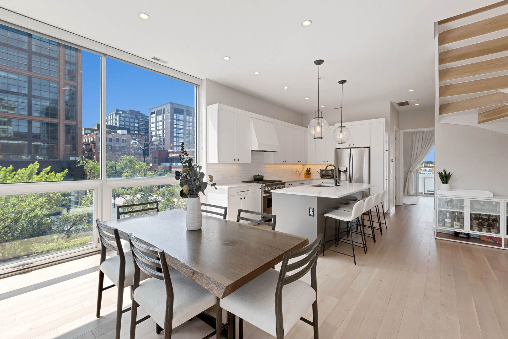 155 North Aberdeen Street, Unit 304 Chicago, IL 60607 - Photo 6 of 33 a view of a dining room with furniture window and wooden floor