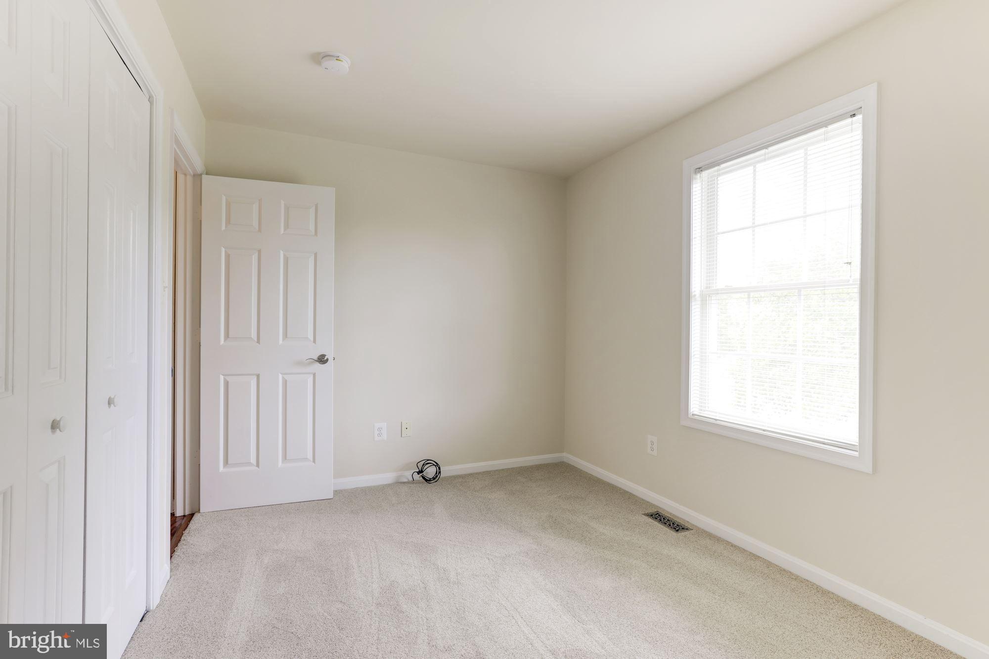 14065 Micah Road Rixeyville, VA 22737 - Photo 20 of 40 an empty room with a window