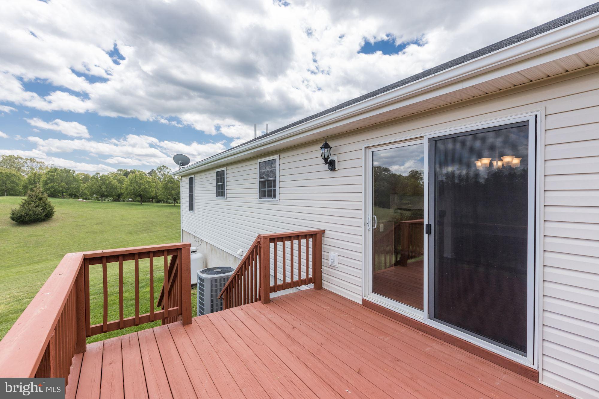 14065 Micah Road Rixeyville, VA 22737 - Photo 35 of 40 a view of a house with backyard and deck