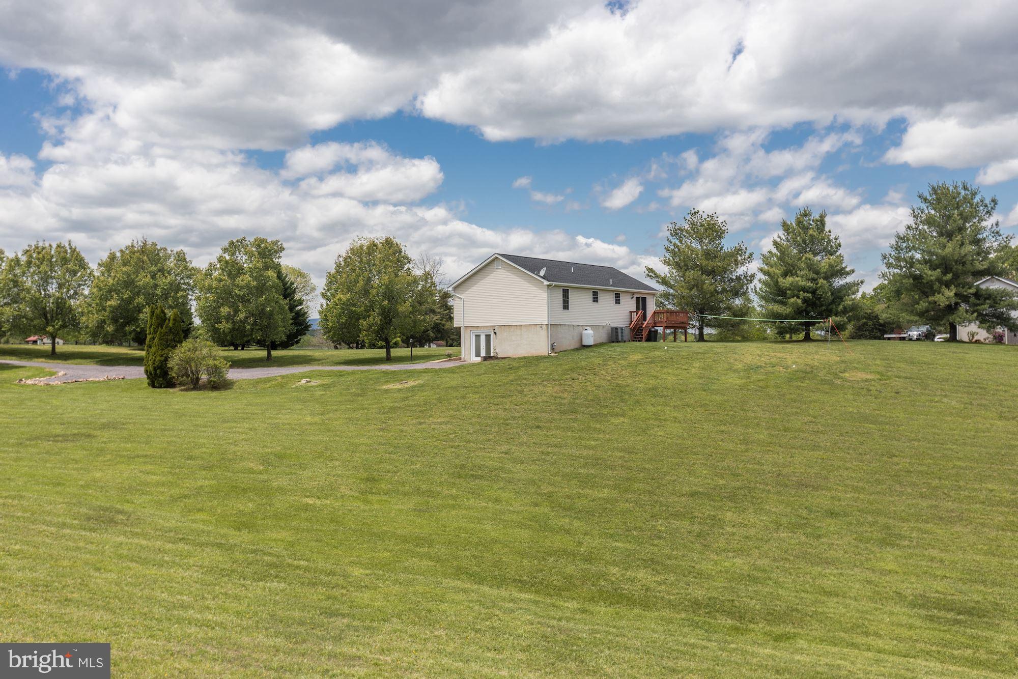 14065 Micah Road Rixeyville, VA 22737 - Photo 37 of 40 a view of a house with a yard