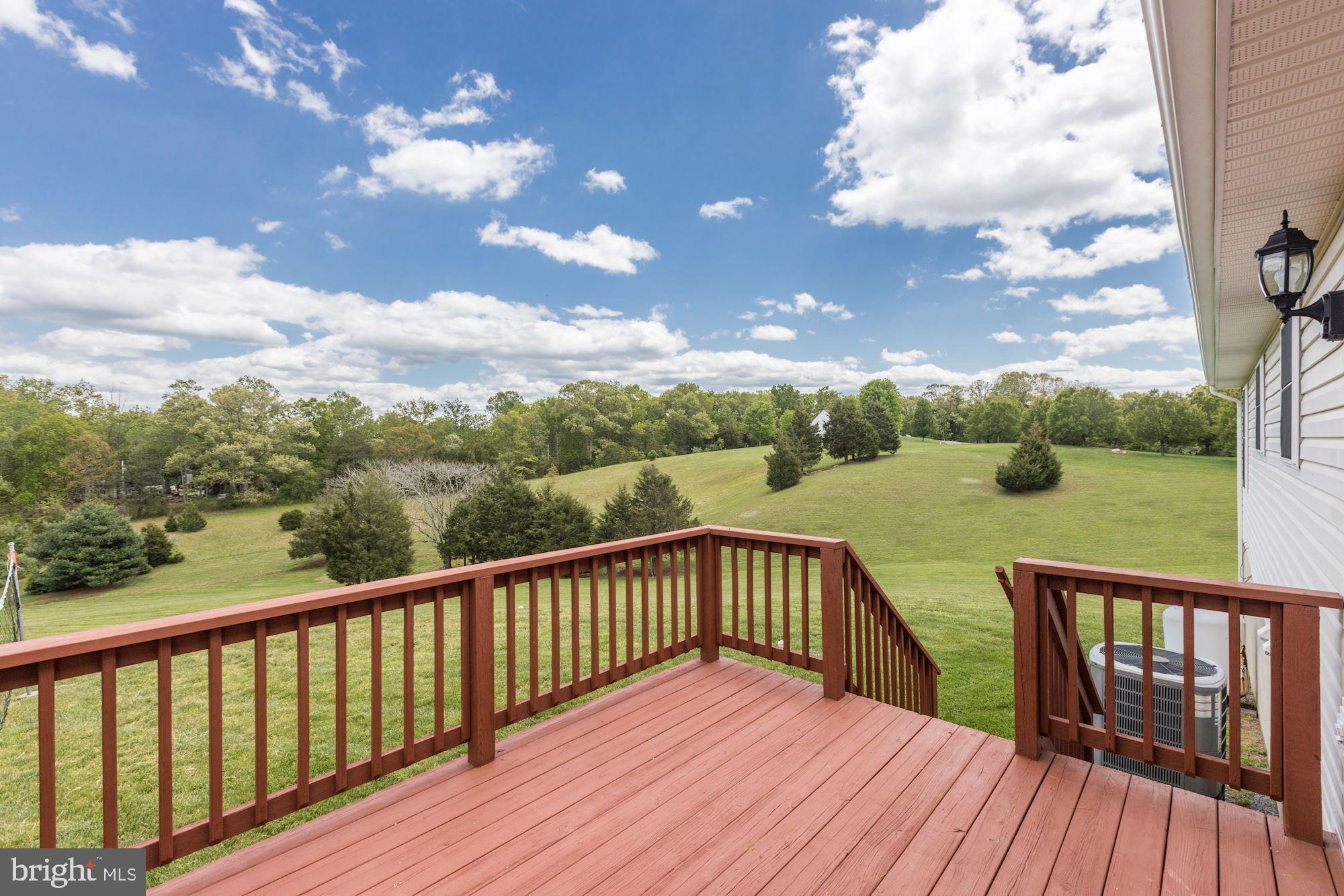 14065 Micah Road Rixeyville, VA 22737 - Photo 5 of 40 a balcony with wooden floor and lake view