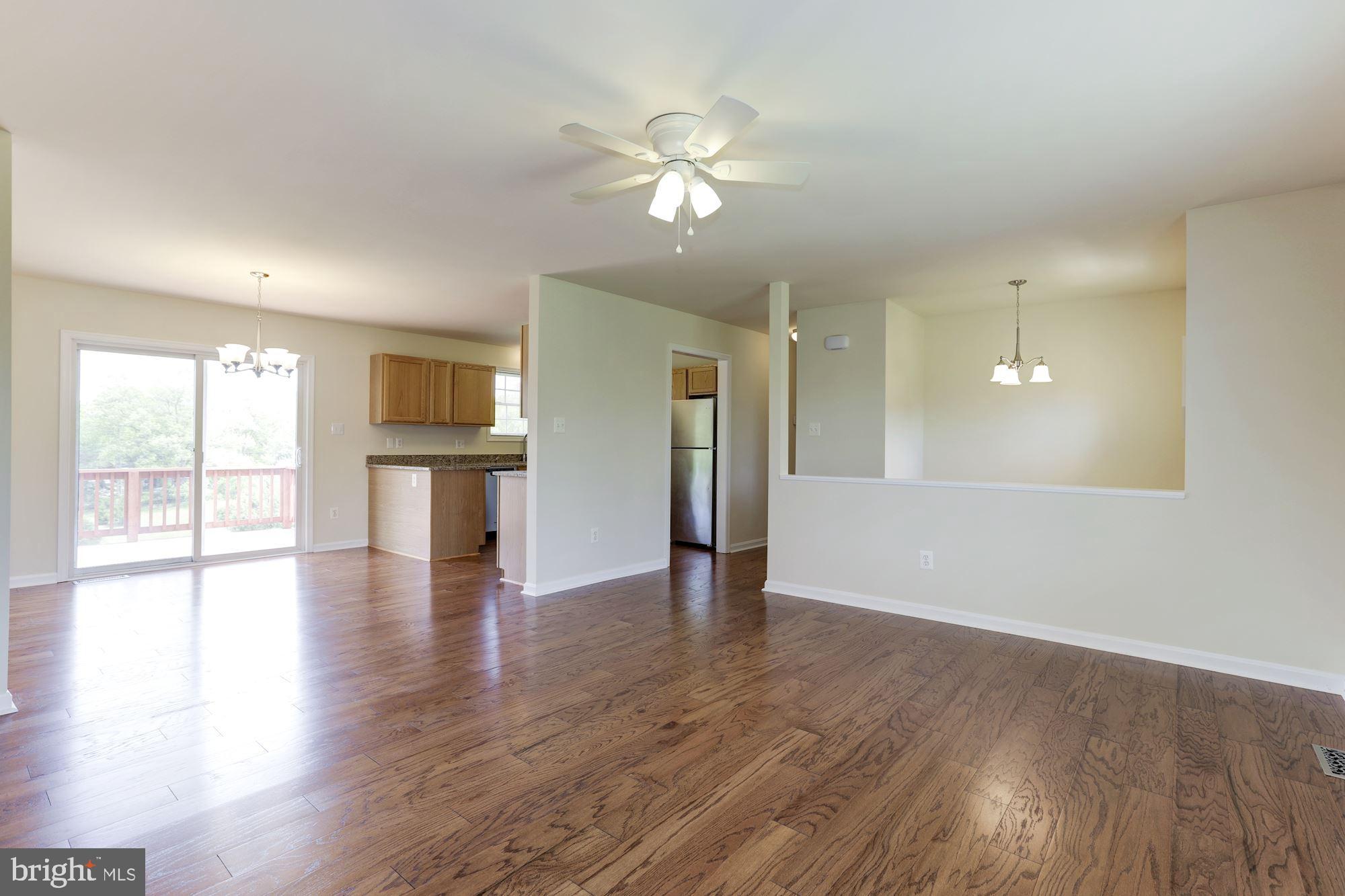 14065 Micah Road Rixeyville, VA 22737 - Photo 40 of 40 a view of an empty room with wooden floor and a window
