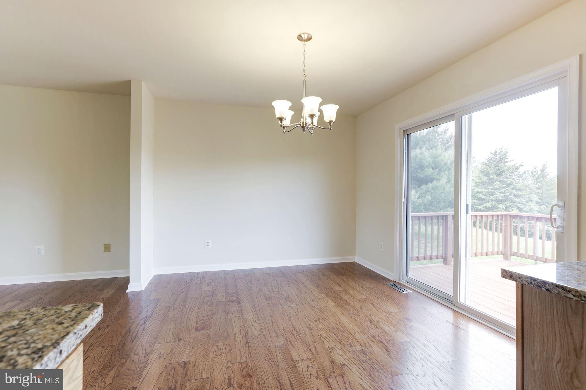 14065 Micah Road Rixeyville, VA 22737 - Photo 9 of 40 wooden floor in an empty room with a window