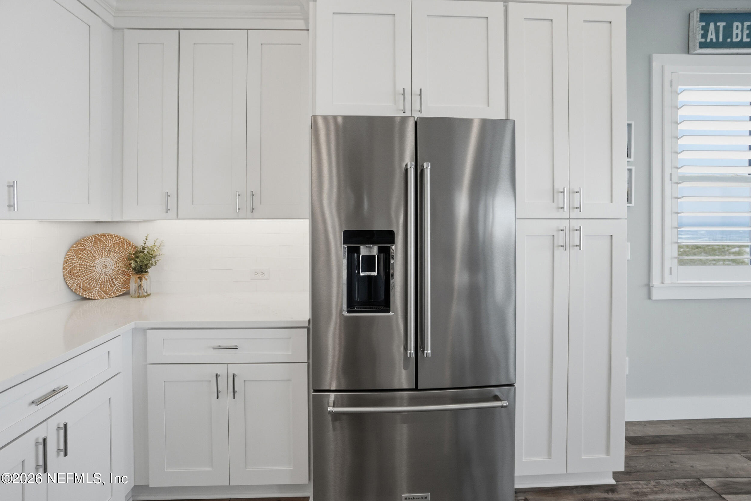 1717 Strand Street Neptune Beach, FL 32266 - Photo 19 of 84 a white refrigerator freezer sitting in a kitchen