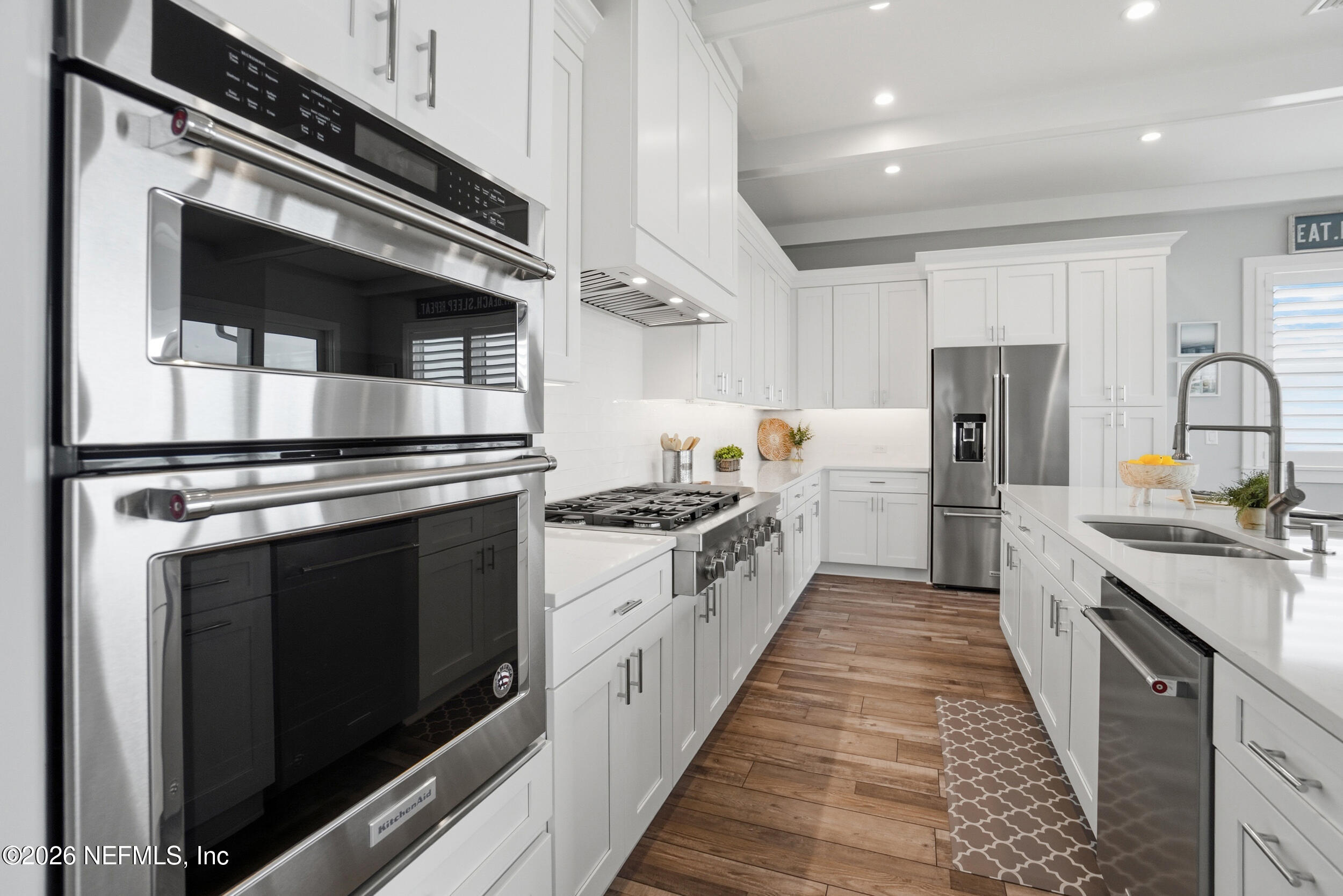 1717 Strand Street Neptune Beach, FL 32266 - Photo 20 of 84 a kitchen with stainless steel appliances a stove microwave and cabinets