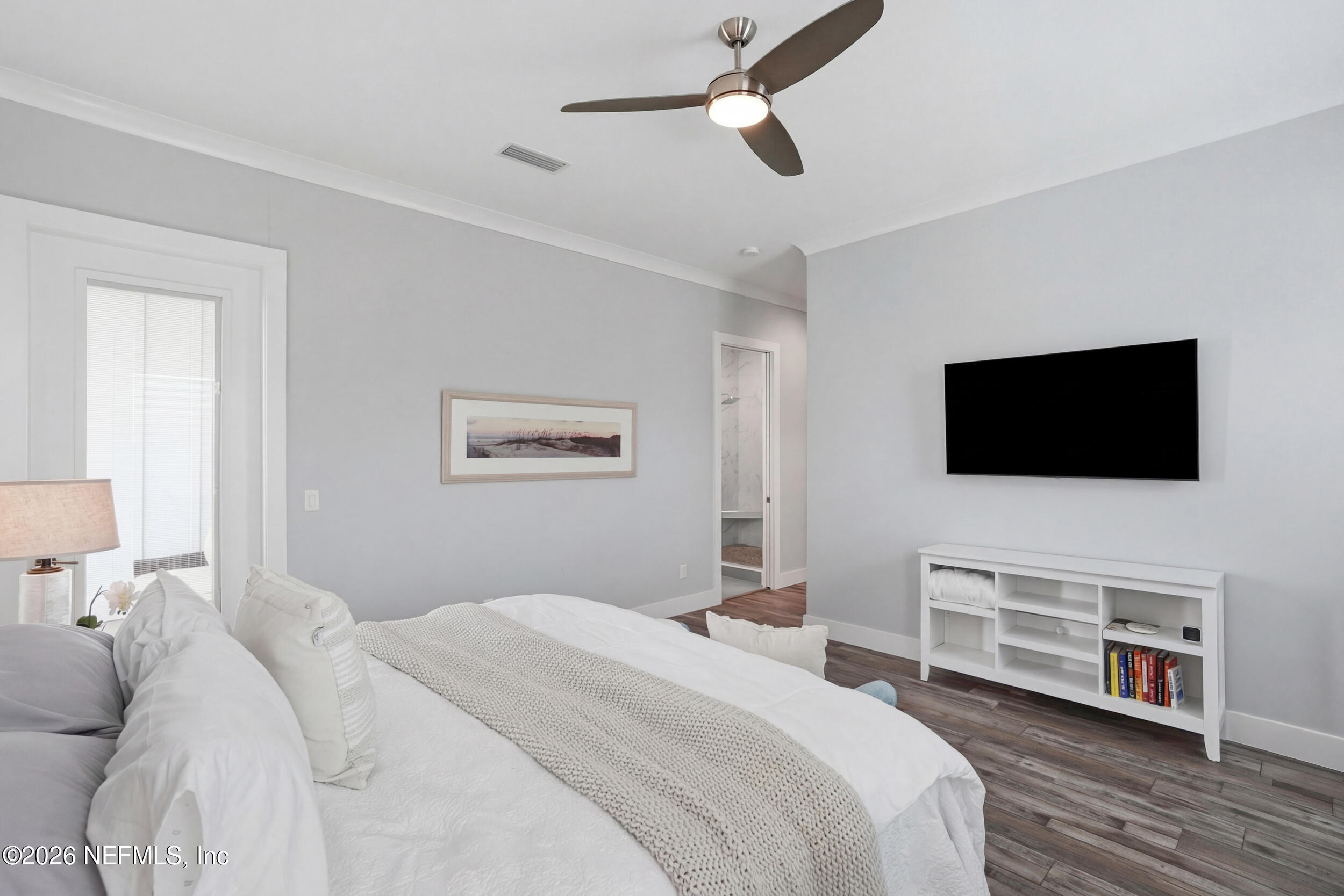 1717 Strand Street Neptune Beach, FL 32266 - Photo 24 of 84 a bedroom with a bed and a flat screen tv