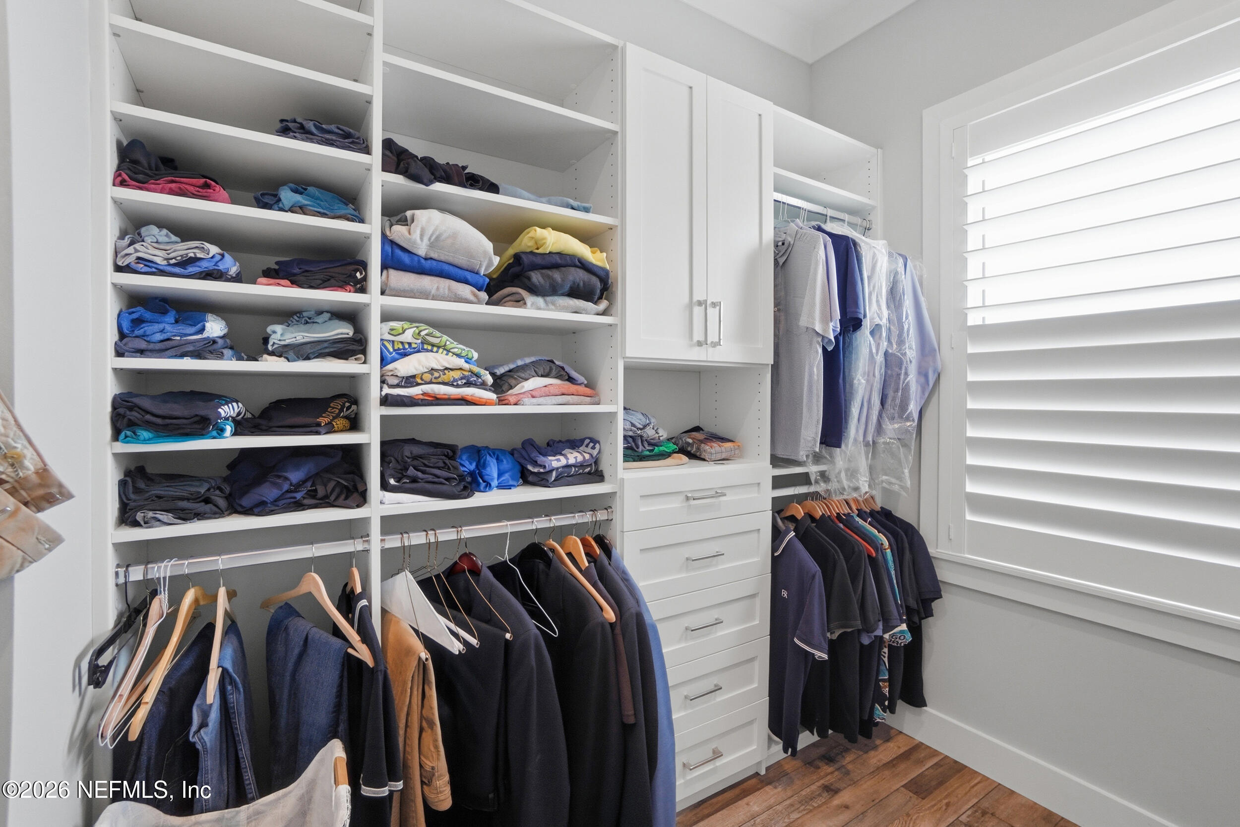 1717 Strand Street Neptune Beach, FL 32266 - Photo 31 of 84 a view of walk in closet with clothes and shoes