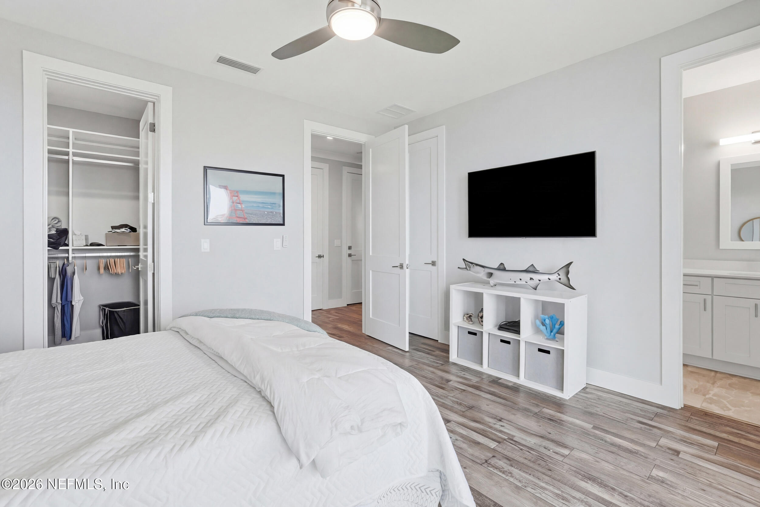 1717 Strand Street Neptune Beach, FL 32266 - Photo 41 of 84 a bedroom with a bed and a flat screen tv