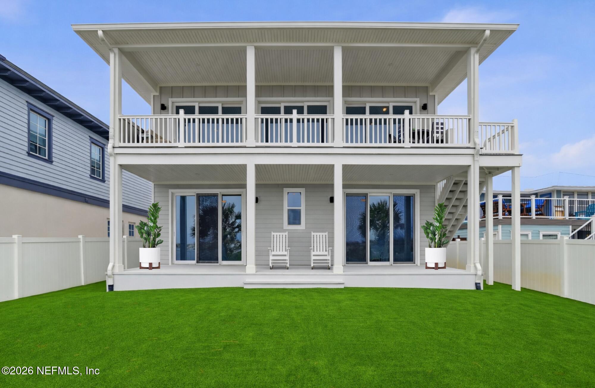 1717 Strand Street Neptune Beach, FL 32266 - Photo 46 of 84 front view of a building with a yard