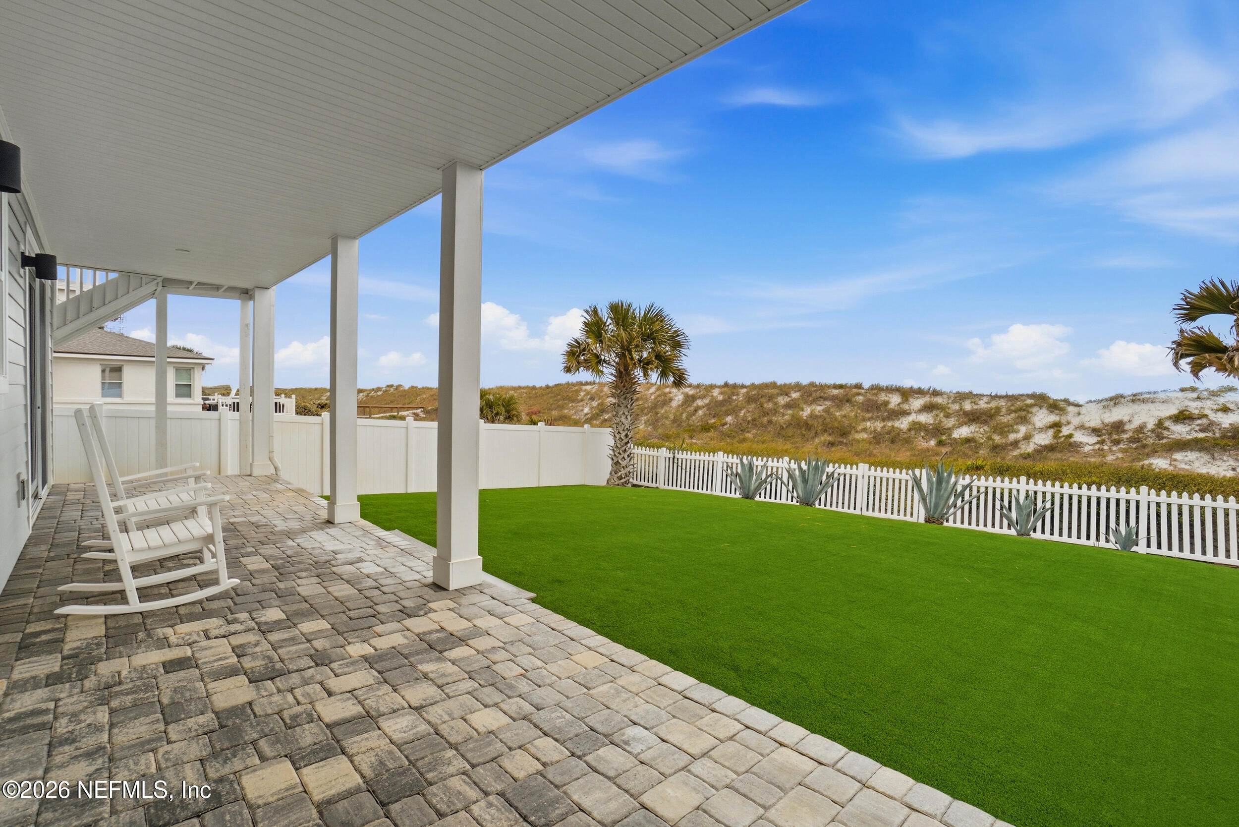 1717 Strand Street Neptune Beach, FL 32266 - Photo 49 of 84 a view of a garden with lawn chairs