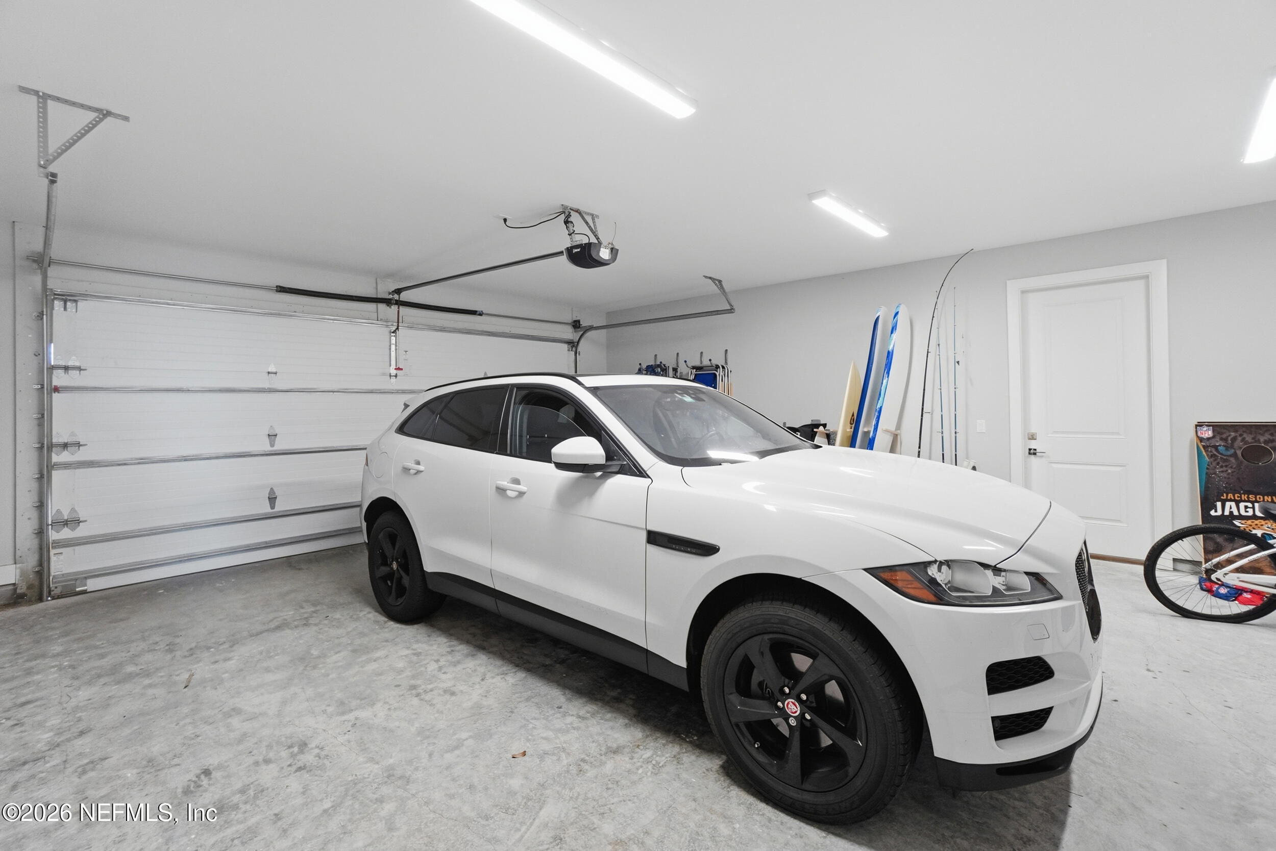 1717 Strand Street Neptune Beach, FL 32266 - Photo 51 of 84 a utility room with a car parked