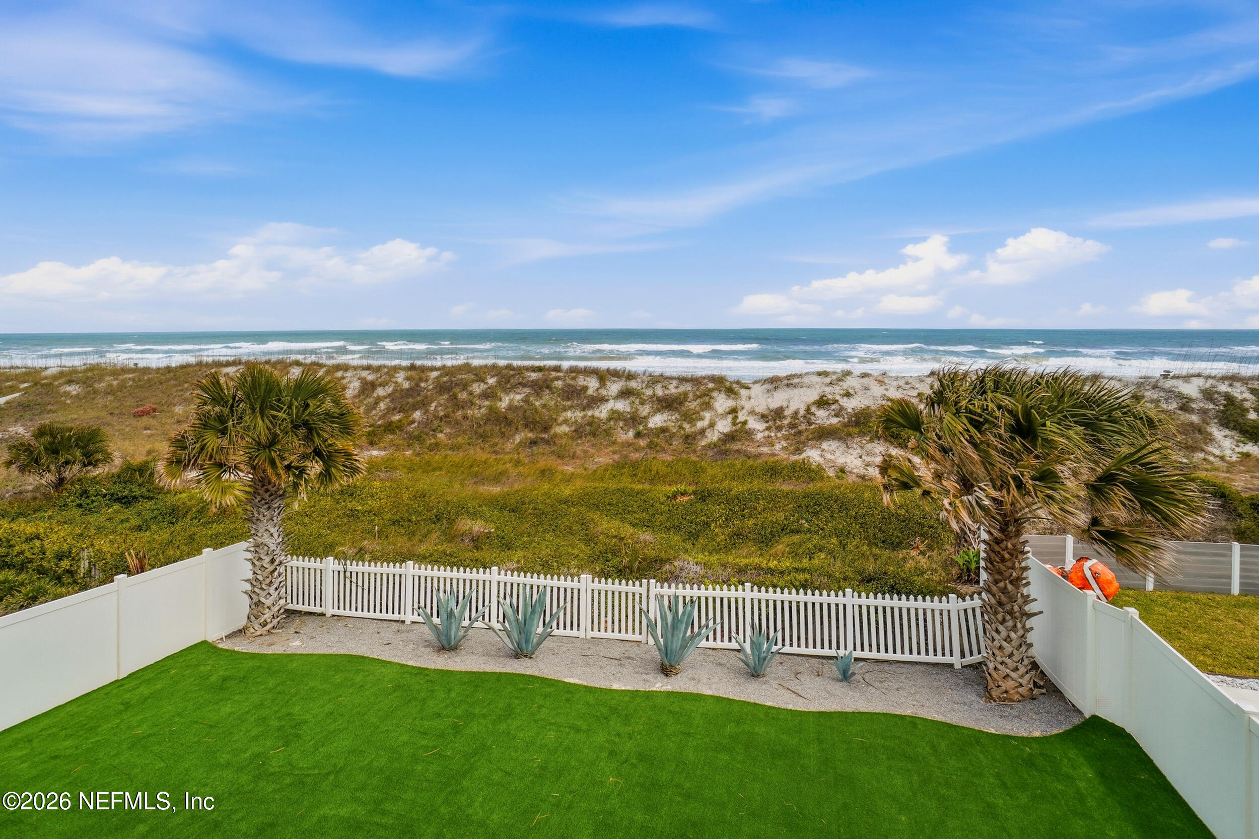 1717 Strand Street Neptune Beach, FL 32266 - Photo 8 of 84 a view of a garden with an ocean view