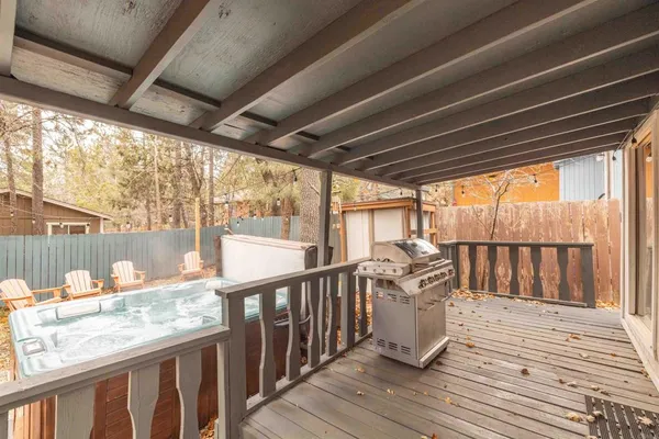 a view of a balcony with wooden floor