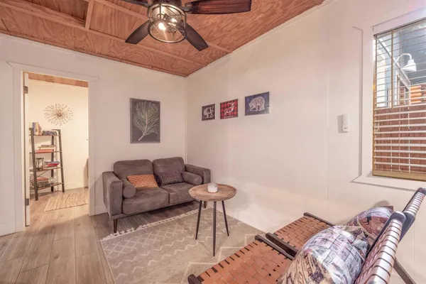 a living room with furniture and a window