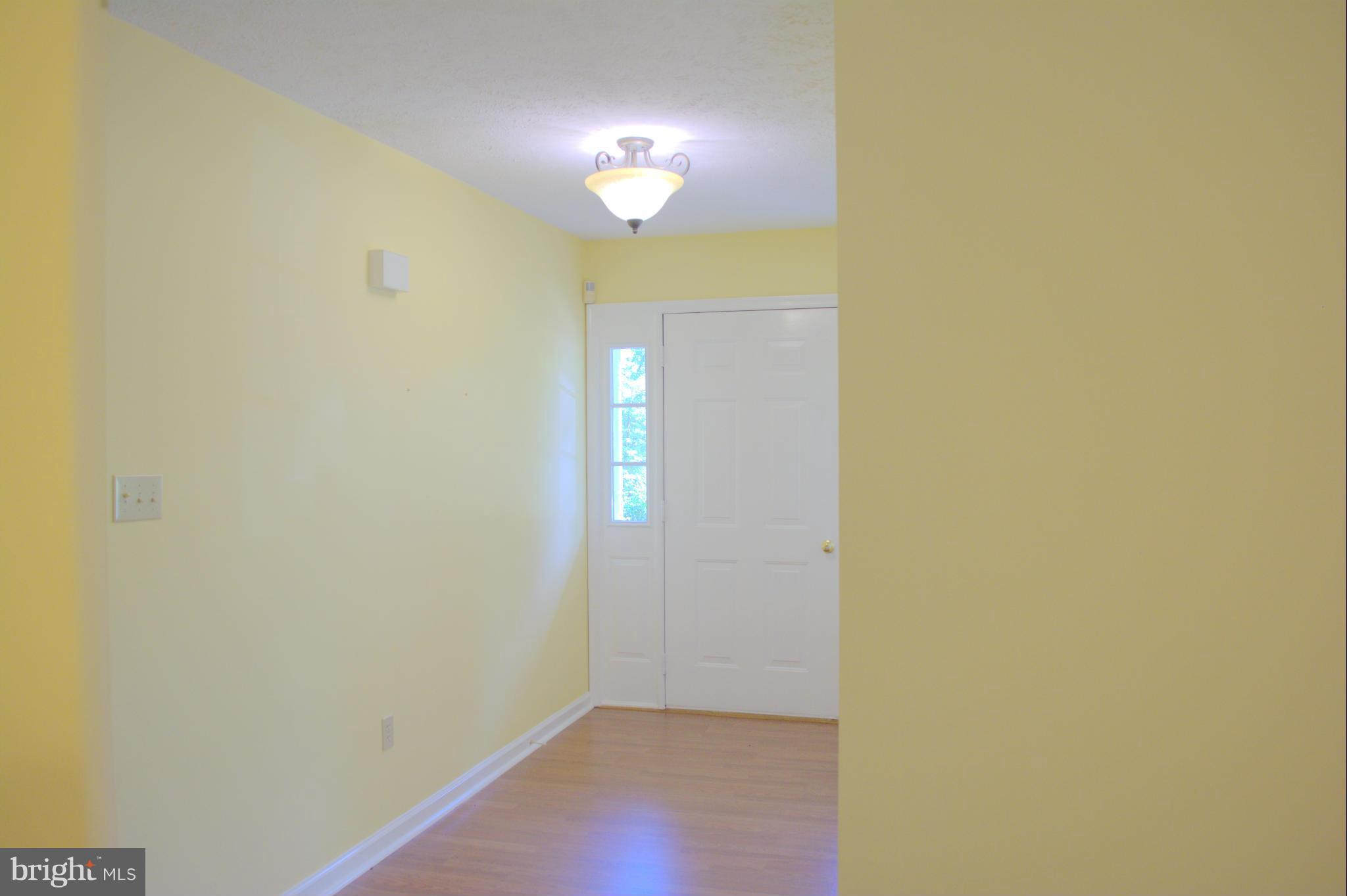 310 High Knob Road Front Royal, VA 22630 - Photo 13 of 30 a view of a hallway with a chandelier fan