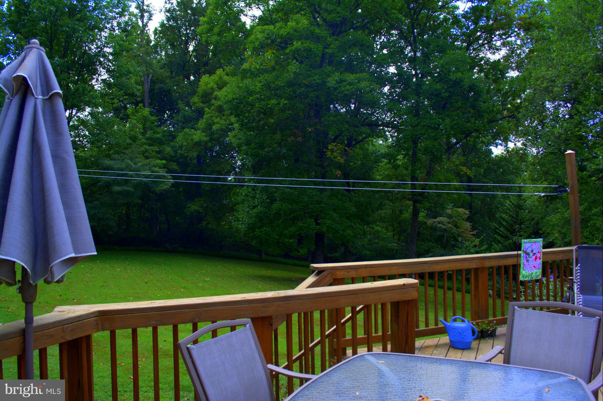 310 High Knob Road Front Royal, VA 22630 - Photo 29 of 30 a view of a deck with a chair and floor to ceiling window
