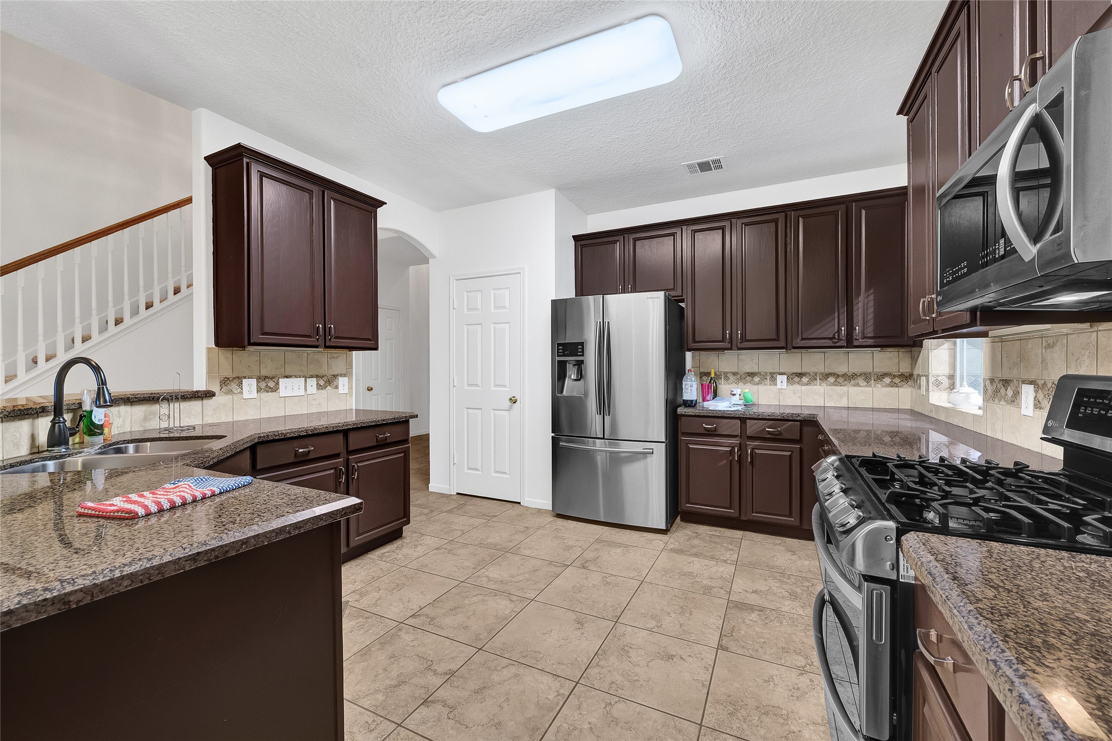 9606 Summer Run Houston, TX 77064 - Photo 15 of 41 kitchen featuring granite counters, modern finishes.
