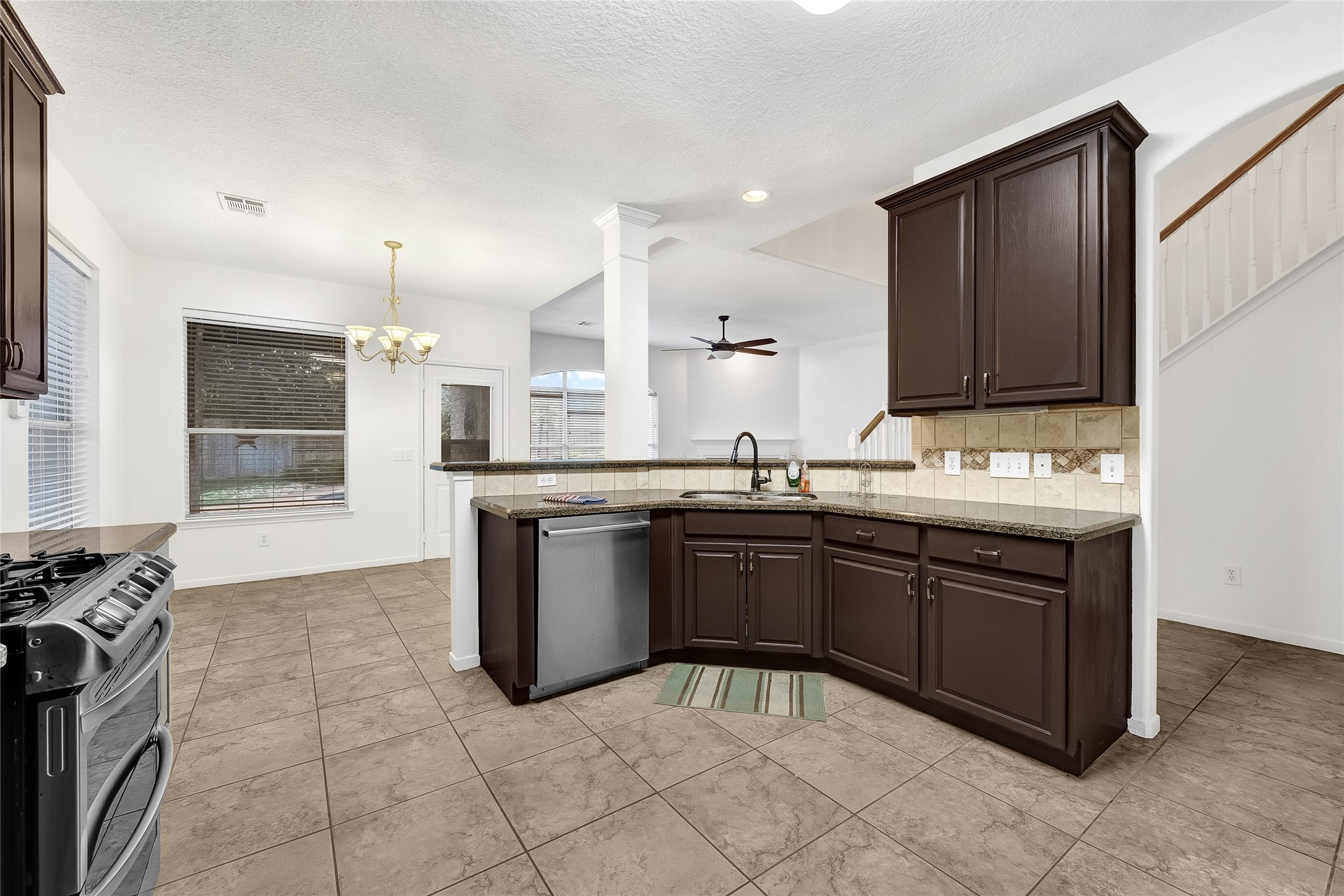 9606 Summer Run Houston, TX 77064 - Photo 18 of 41 Open concept kitchen with ample counter space, custom cabinetry, and seamless flow to living area.