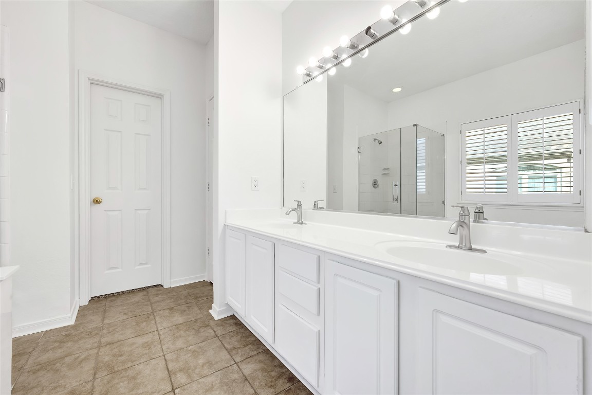 9606 Summer Run Houston, TX 77064 - Photo 19 of 41 Luxury primary bath Double sinks with clean finishes. Private toilet for added comfort and functionality within the primary bath.