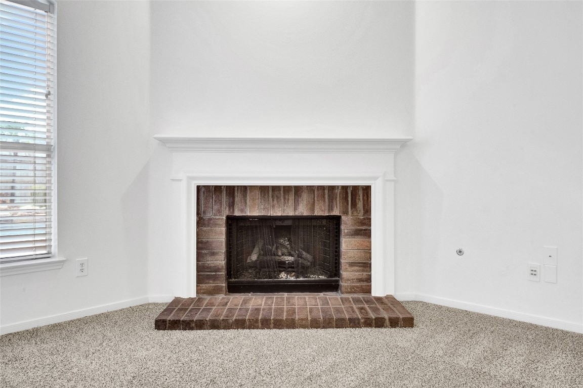 9606 Summer Run Houston, TX 77064 - Photo 9 of 41 Cozy gas fireplace with mantel and accent lighting creating a warm focal point for the space.