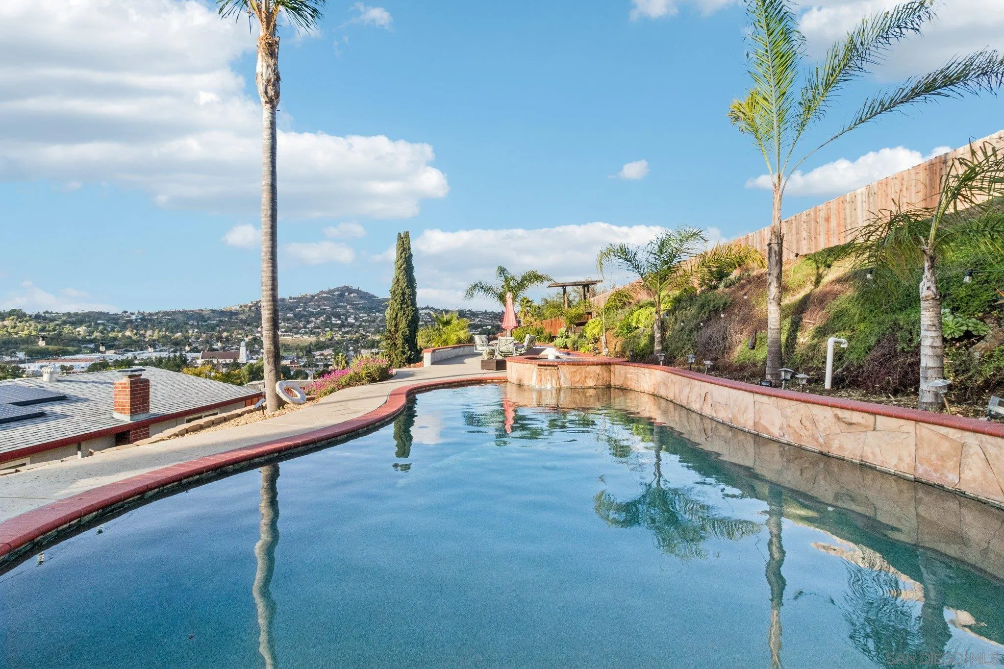 a view of swimming pool from a balcony